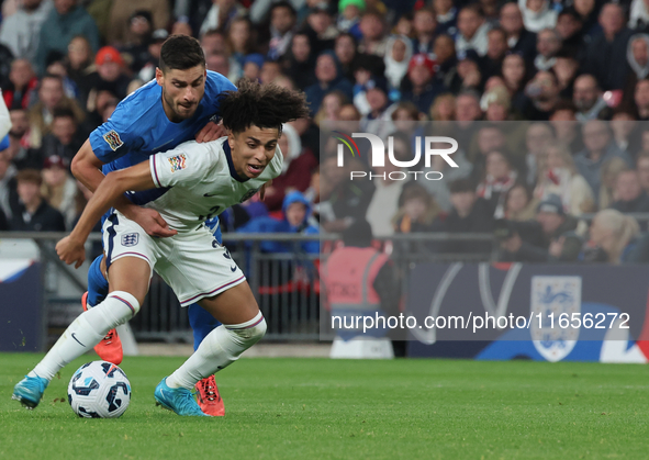 Rico Lewis of Manchester City, England, holds off Giorgos Masouras of Olympiacos, Greece, during the UEFA Nations League Group 2 match betwe...