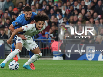 Rico Lewis of Manchester City, England, holds off Giorgos Masouras of Olympiacos, Greece, during the UEFA Nations League Group 2 match betwe...