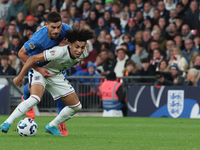 Rico Lewis of Manchester City, England, holds off Giorgos Masouras of Olympiacos, Greece, during the UEFA Nations League Group 2 match betwe...