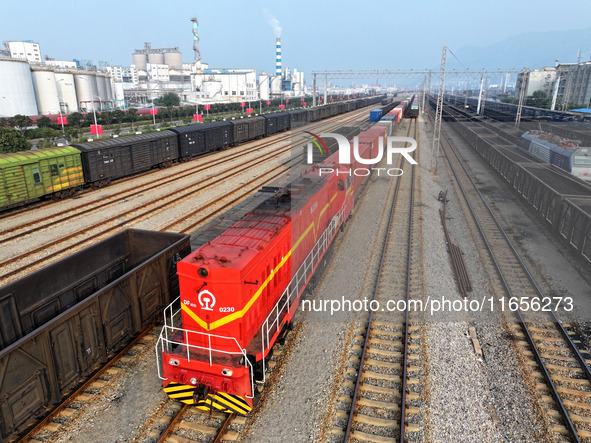 A cargo train prepares to depart at a railway marshalling station in Lianyungang, China, on October 11, 2024. 