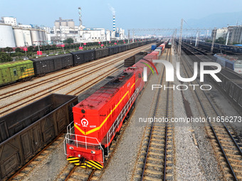 A cargo train prepares to depart at a railway marshalling station in Lianyungang, China, on October 11, 2024. (