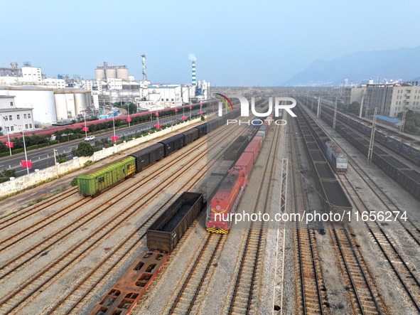 A cargo train prepares to depart at a railway marshalling station in Lianyungang, China, on October 11, 2024. 