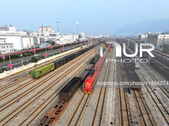 A cargo train prepares to depart at a railway marshalling station in Lianyungang, China, on October 11, 2024. (