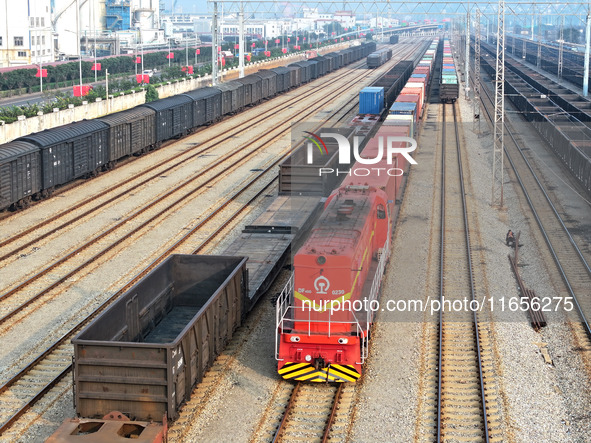 A cargo train prepares to depart at a railway marshalling station in Lianyungang, China, on October 11, 2024. 