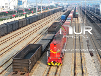 A cargo train prepares to depart at a railway marshalling station in Lianyungang, China, on October 11, 2024. (