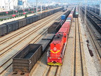 A cargo train prepares to depart at a railway marshalling station in Lianyungang, China, on October 11, 2024. (