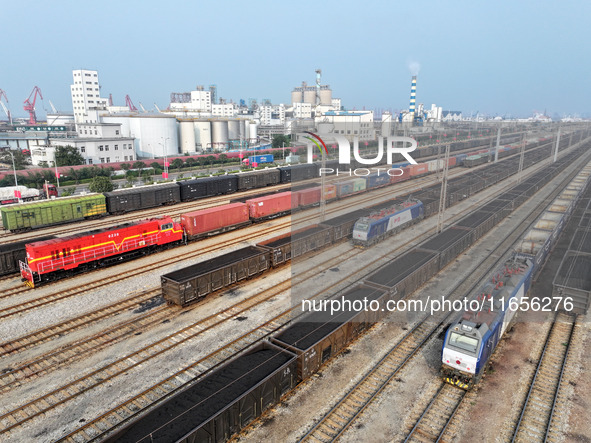 A cargo train prepares to depart at a railway marshalling station in Lianyungang, China, on October 11, 2024. 