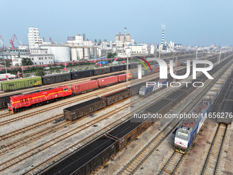 A cargo train prepares to depart at a railway marshalling station in Lianyungang, China, on October 11, 2024. (