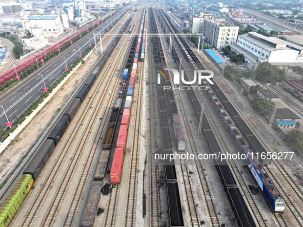 A cargo train prepares to depart at a railway marshalling station in Lianyungang, China, on October 11, 2024. 