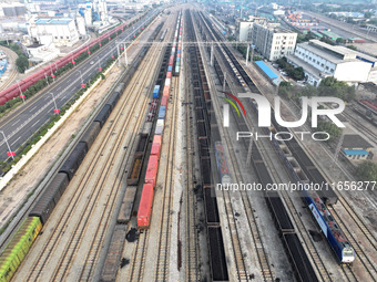 A cargo train prepares to depart at a railway marshalling station in Lianyungang, China, on October 11, 2024. (