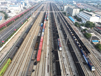 A cargo train prepares to depart at a railway marshalling station in Lianyungang, China, on October 11, 2024. (