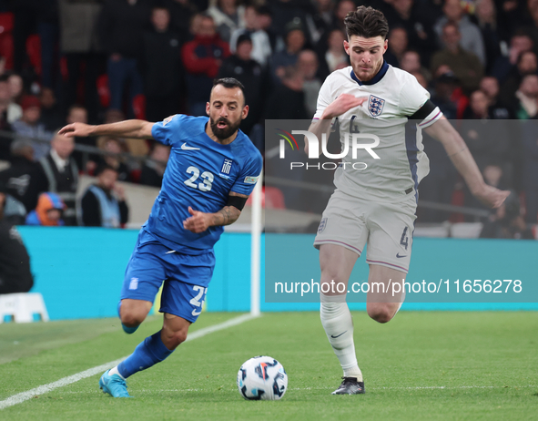 L-R Manolis Siopis of Greece, from Cardiff City, takes on Declan Rice of England, from Arsenal, during the UEFA Nations League Group 2 match...