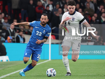 L-R Manolis Siopis of Greece, from Cardiff City, takes on Declan Rice of England, from Arsenal, during the UEFA Nations League Group 2 match...