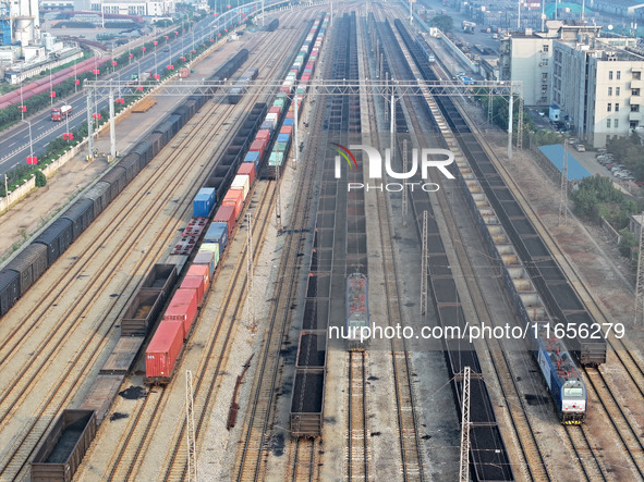 A cargo train prepares to depart at a railway marshalling station in Lianyungang, China, on October 11, 2024. 