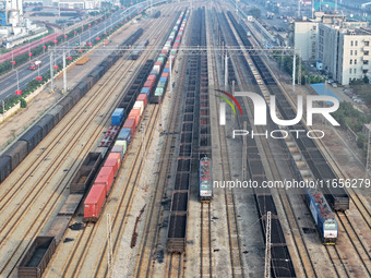 A cargo train prepares to depart at a railway marshalling station in Lianyungang, China, on October 11, 2024. (