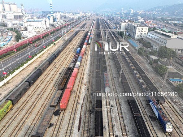 A cargo train prepares to depart at a railway marshalling station in Lianyungang, China, on October 11, 2024. 