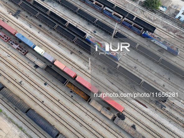 A cargo train prepares to depart at a railway marshalling station in Lianyungang, China, on October 11, 2024. 