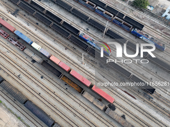 A cargo train prepares to depart at a railway marshalling station in Lianyungang, China, on October 11, 2024. (