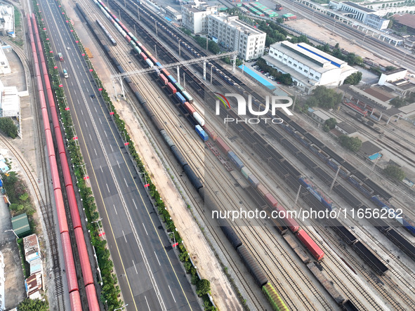 A cargo train prepares to depart at a railway marshalling station in Lianyungang, China, on October 11, 2024. 