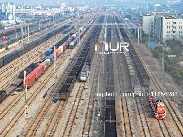 A cargo train prepares to depart at a railway marshalling station in Lianyungang, China, on October 11, 2024. 