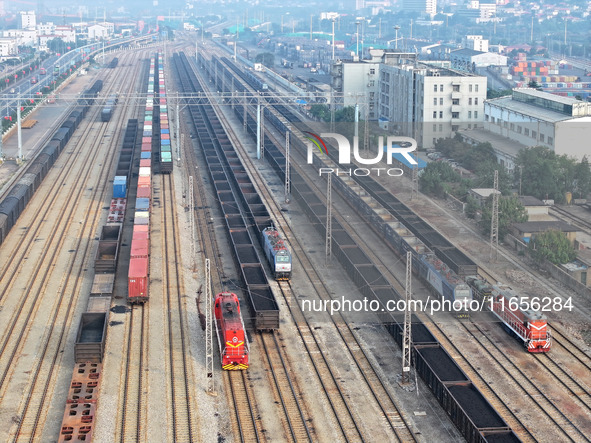 A cargo train prepares to depart at a railway marshalling station in Lianyungang, China, on October 11, 2024. 