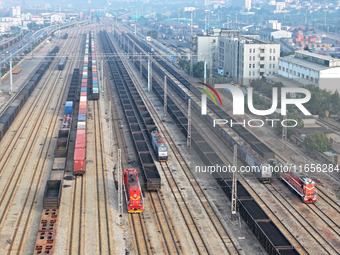 A cargo train prepares to depart at a railway marshalling station in Lianyungang, China, on October 11, 2024. (