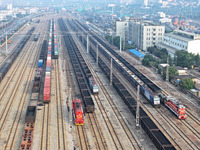 A cargo train prepares to depart at a railway marshalling station in Lianyungang, China, on October 11, 2024. (