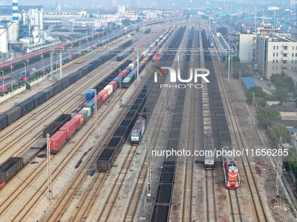 A cargo train prepares to depart at a railway marshalling station in Lianyungang, China, on October 11, 2024. 