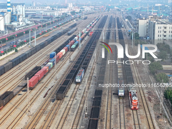 A cargo train prepares to depart at a railway marshalling station in Lianyungang, China, on October 11, 2024. (