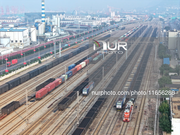 A cargo train prepares to depart at a railway marshalling station in Lianyungang, China, on October 11, 2024. 