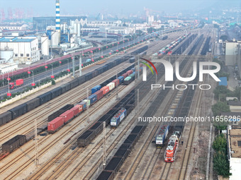 A cargo train prepares to depart at a railway marshalling station in Lianyungang, China, on October 11, 2024. (