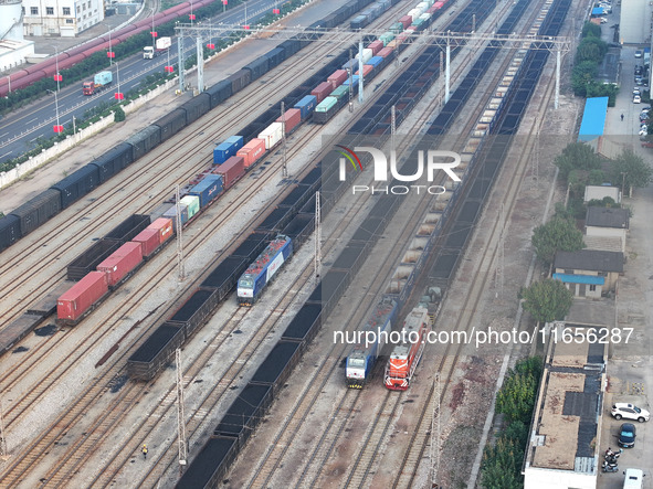 A cargo train prepares to depart at a railway marshalling station in Lianyungang, China, on October 11, 2024. 