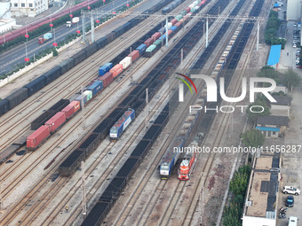 A cargo train prepares to depart at a railway marshalling station in Lianyungang, China, on October 11, 2024. (