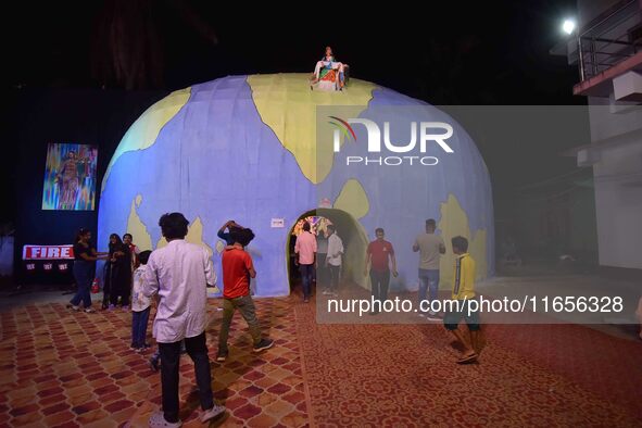 A community 'puja pandal' themed on ''justice for RG Kar rape and murder incident'' during the Durga Puja festival in Nagaon district, Assam...