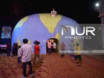 A community 'puja pandal' themed on ''justice for RG Kar rape and murder incident'' during the Durga Puja festival in Nagaon district, Assam...