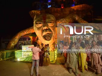 A community 'puja pandal' themed on ''Destroy Nature'' during the Durga Puja festival in Nagaon district, Assam, India, on October 11, 2024....