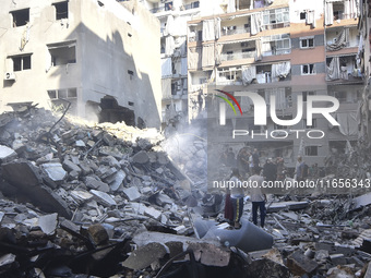 This picture shows the destruction at the site of an Israeli air strike in the Basta area, in Beirut, Lebanon, on October 11, 2024, amid the...