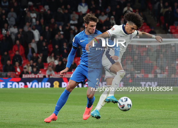 Rico Lewis of England holds off Giorgos Vagiannidis of Greece during the UEFA Nations League Group 2 match between England and Greece at Wem...