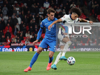 Rico Lewis of England holds off Giorgos Vagiannidis of Greece during the UEFA Nations League Group 2 match between England and Greece at Wem...