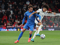 Rico Lewis of England holds off Giorgos Vagiannidis of Greece during the UEFA Nations League Group 2 match between England and Greece at Wem...