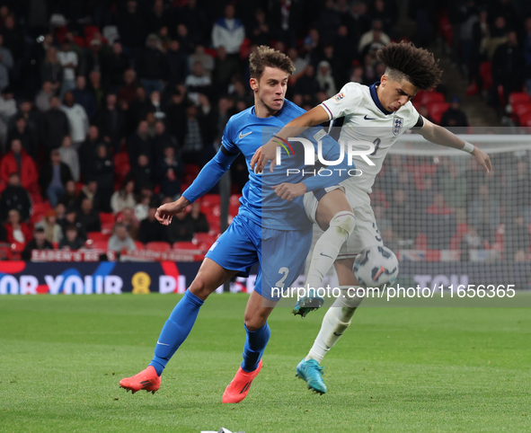 Rico Lewis of England holds off Giorgos Vagiannidis of Greece during the UEFA Nations League Group 2 match between England and Greece at Wem...