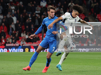 Rico Lewis of England holds off Giorgos Vagiannidis of Greece during the UEFA Nations League Group 2 match between England and Greece at Wem...