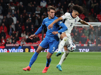 Rico Lewis of England holds off Giorgos Vagiannidis of Greece during the UEFA Nations League Group 2 match between England and Greece at Wem...