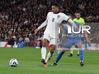 From left to right, Jude Bellingham of Real Madrid and England holds off Dimitris Kourbelis of Al-Khaleej and Greece during the UEFA Nations...