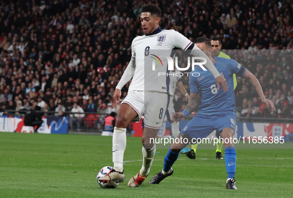 From left to right, Jude Bellingham of Real Madrid and England holds off Dimitris Kourbelis of Al-Khaleej and Greece during the UEFA Nations...