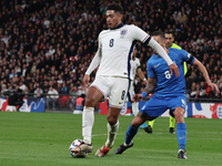 From left to right, Jude Bellingham of Real Madrid and England holds off Dimitris Kourbelis of Al-Khaleej and Greece during the UEFA Nations...