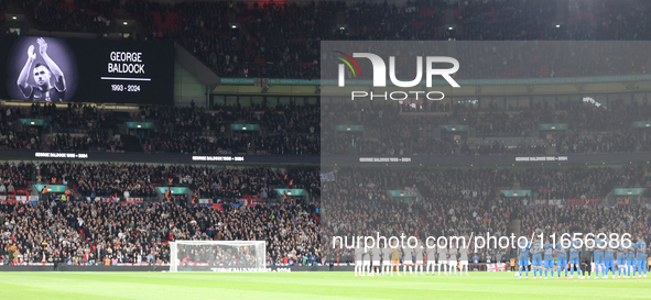 The England and Greece teams stand in silence for Gordon Baldock during the UEFA Nations League Group 2 match between England and Greece at...