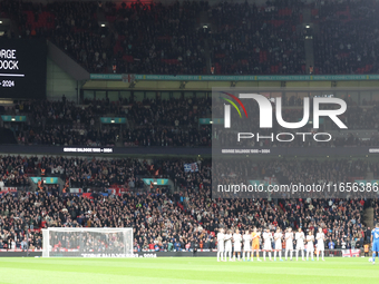 The England and Greece teams stand in silence for Gordon Baldock during the UEFA Nations League Group 2 match between England and Greece at...