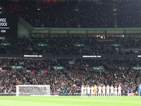 The England and Greece teams stand in silence for Gordon Baldock during the UEFA Nations League Group 2 match between England and Greece at...