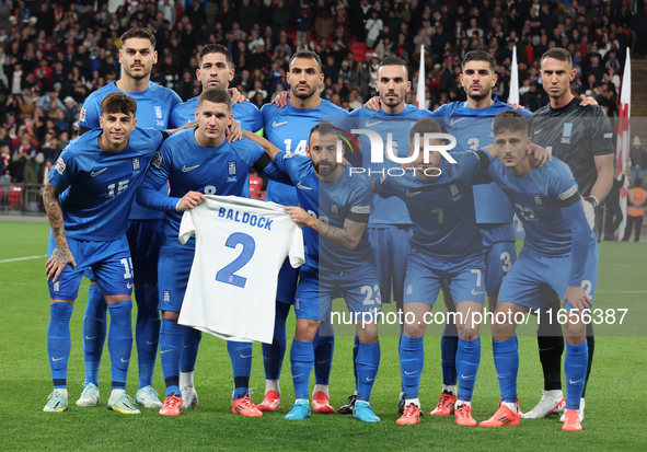 The Greece team poses for a photo. In the back row are Ninos Mavropanos (West Ham United), Tasos Bakasetas (Panathinaikos), Vangelis Pavlidi...